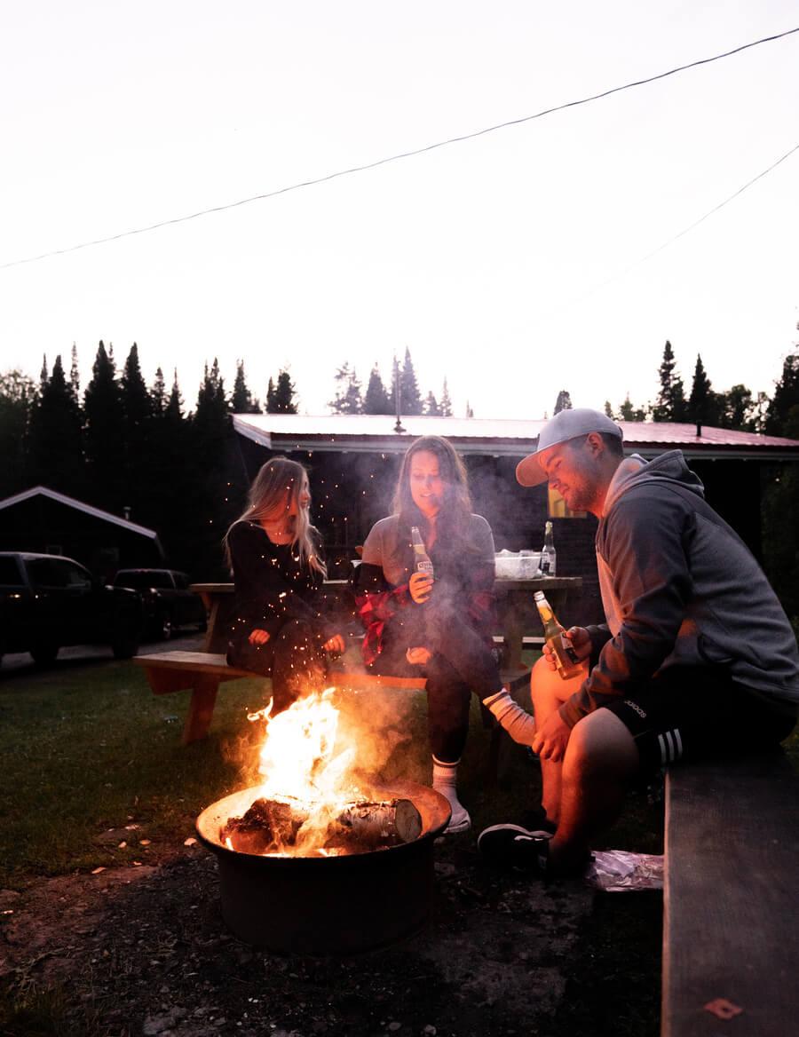 Evening around the fire at Chalets Restigouche