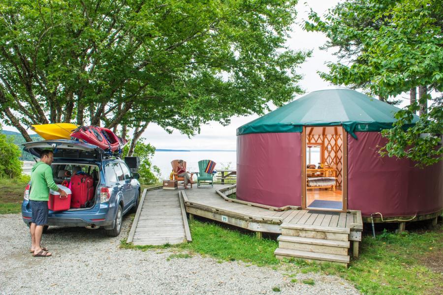 a man unloading a car at the fundy yurts