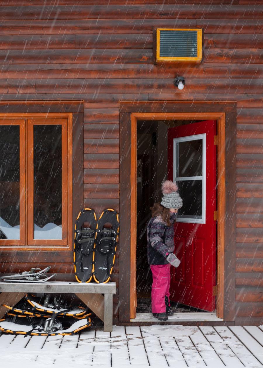 Child at Chalets Restigouche, winter