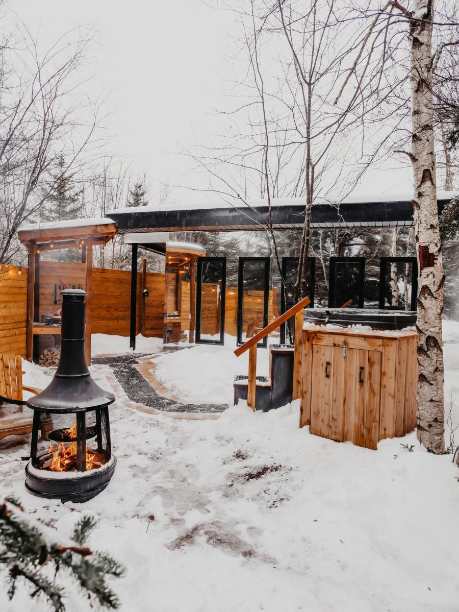 Creekside RNR mirror cabin in winter, Cocagne