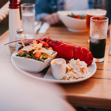 A plate of cooked lobster on a table.