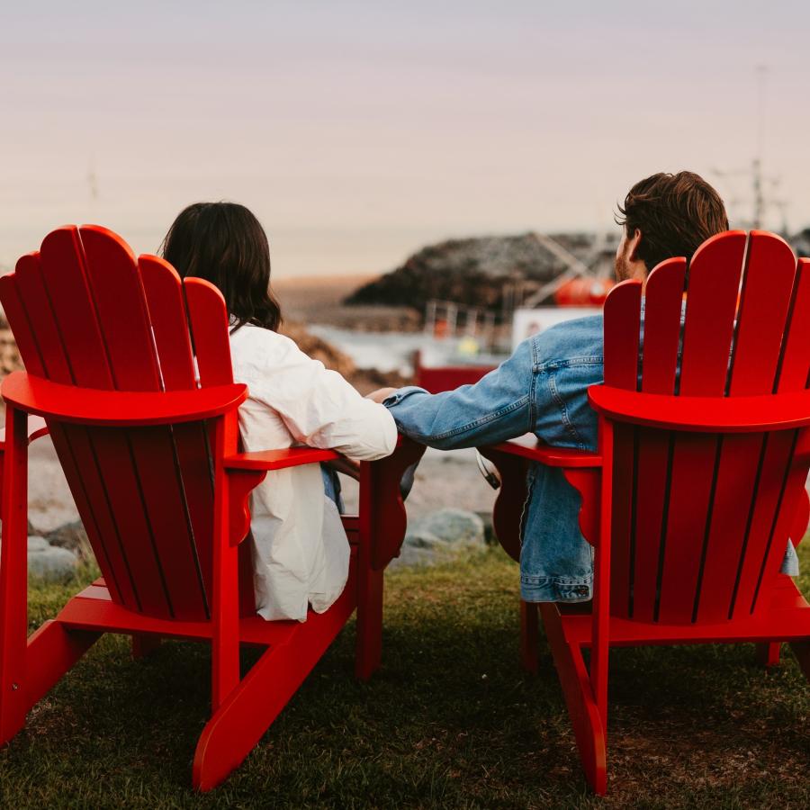 Couple on red chairs, St. Martins